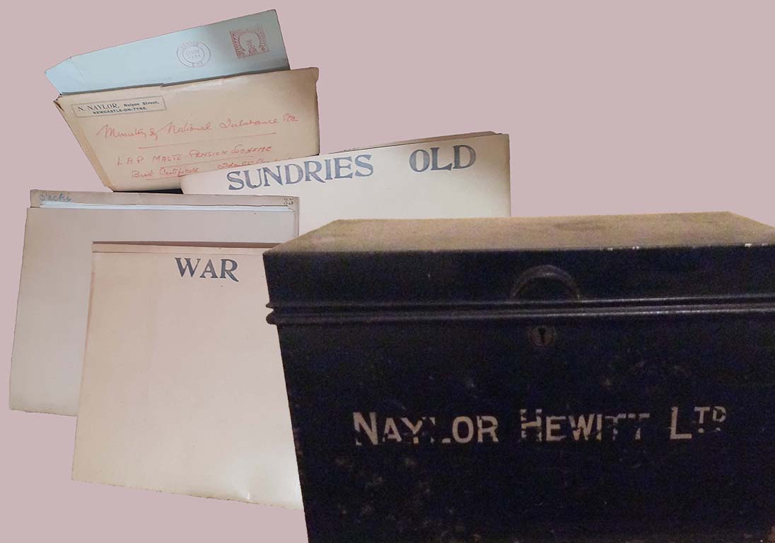 Picture An old black tin strong box with Naylor Hewitt Ltd written on it.